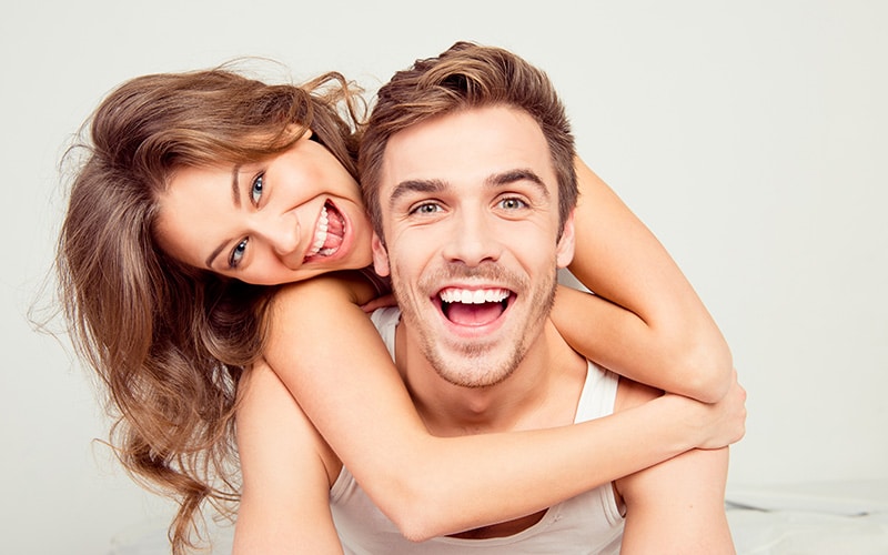 Couple Smiling With White Teeth